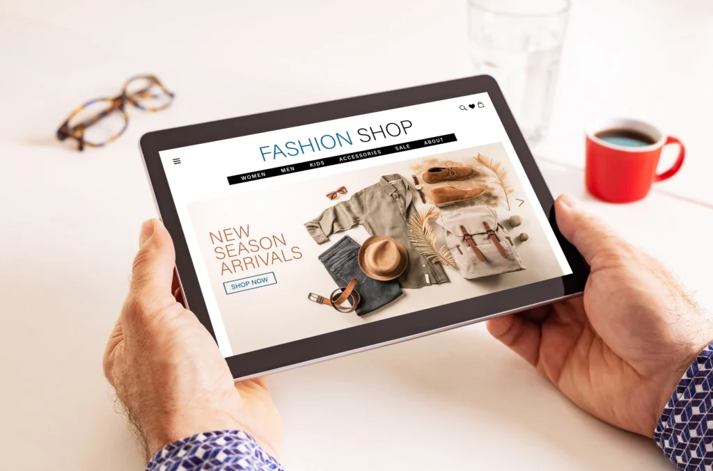 Tablet showing Fashion Shop website with new season arrivals banner and accessories
